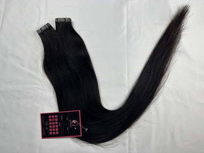 Indian Virgin Straight Tape-In Hair Extensions by Gaurash Beauty Supply Inc showing smooth, straight hair extensions on a white background.