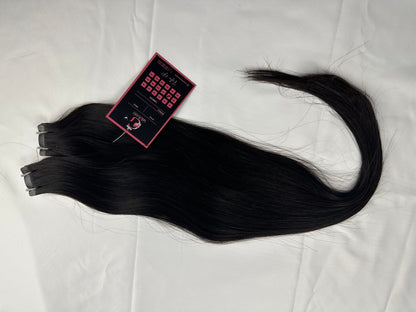 Indian Virgin Straight Tape-In Hair extensions from Gaurash Beauty Supply Inc, showing sleek, straight hair extensions on a white background.