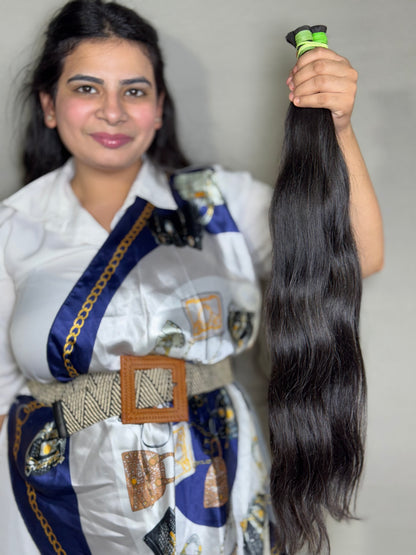 Virgin Indian bulk hair extensions from Gaurash Beauty Supply Inc, showing long, natural Indian hair bundles.