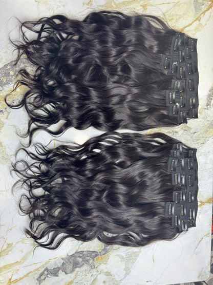 Indian Virgin Wavy Clip-On Hair Extensions by Gaurash Beauty Supply Inc, showing the natural wavy texture and clip details.