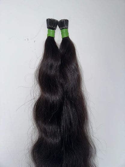 Indian virgin wavy keratin tip hair extensions by Gaurash Beauty Supply Inc, showing natural wavy hair with keratin tips.