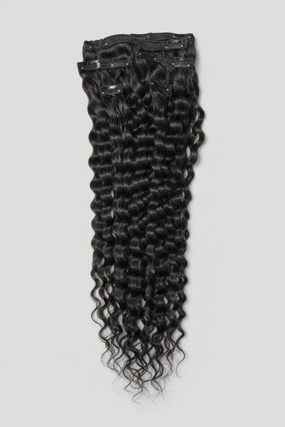 Indian curly virgin hair clip-in extensions from Gaurash Beauty Supply, showcasing thick, natural curl patterns and seamless attachment points.