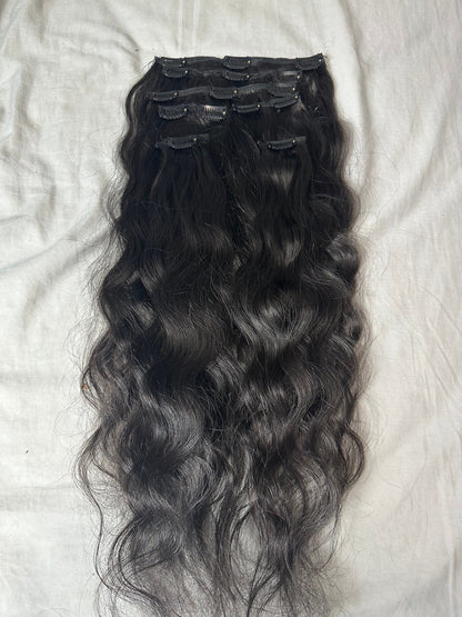 Wavy clip-in human hair extensions by Gaurash Beauty Supply, Virgin Indian hair, 120g with natural wavy texture.