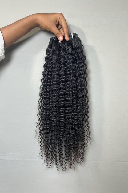 Steam-enhanced raw Indian tight curly hair bundles from Gaurash Beauty Supply, showcasing natural, dense, and tightly coiled curls.