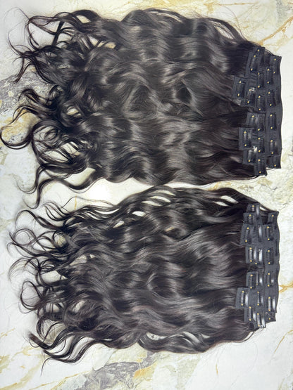 Indian Virgin Wavy Clip-In Hair Extensions by Gaurash Beauty Supply, 200g, showcasing long wavy hair clips on a model.