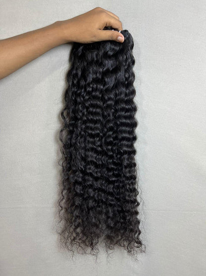 Indian virgin curly human hair bundles for sew-in extensions by Gaurash Beauty Supply, showing natural curly texture and full bundles.