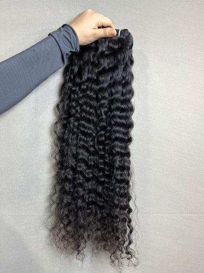 Indian Virgin Curly Human Hair Bundles from Gaurash Beauty Supply, natural curly sew-in extensions displayed in a clear image.