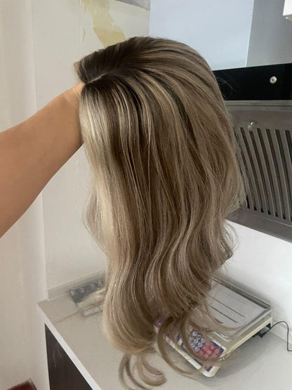 Back view of blonde lace front wig with long loose waves