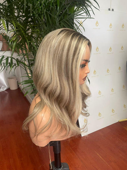 Blonde lace front wig with soft waves, angled side view on mannequin