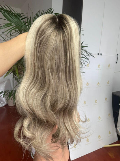 Blonde long wavy lace front wig, full back view with layered ends
