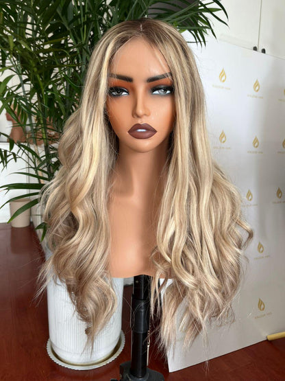 Ash blonde long wavy wig with middle part on mannequin head