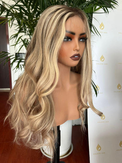 Long ash blonde wavy wig with middle part, side view on mannequin head