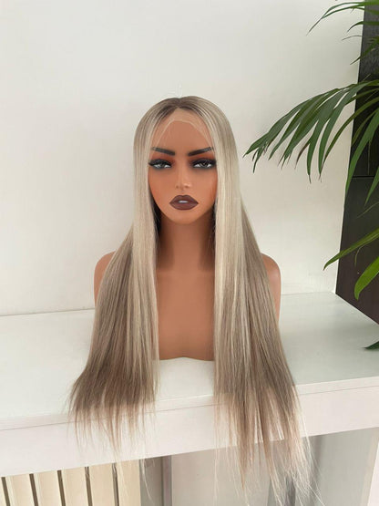 Blonde HD lace front wig made from raw human hair with adjustable cap, styled on a mannequin head.