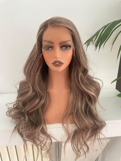 Ash blonde and brown mix lace front wig made from 100% raw human hair, styled with natural waves and a lace front design.