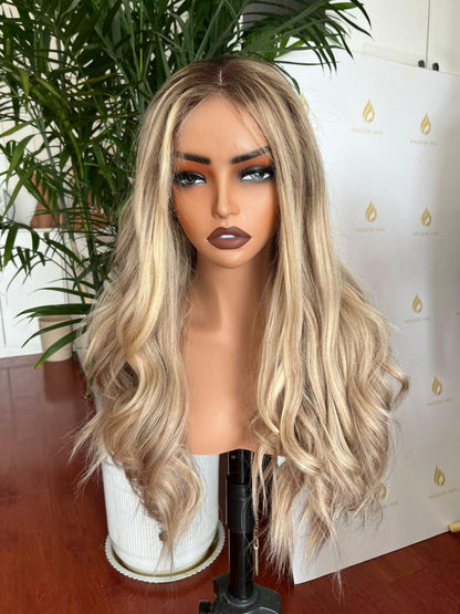 Ash blonde long wavy wig with center part on mannequin head
