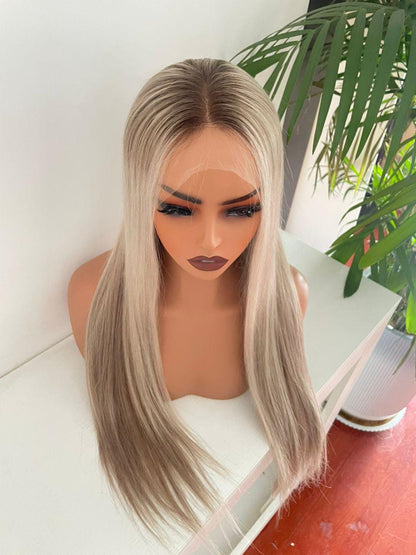 Blonde HD lace front wig made from raw human hair with an adjustable cap, styled on a mannequin head.