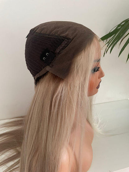 Blonde HD lace front wig with raw human hair and adjustable cap from Gaurash Beauty Supply displayed on a mannequin head.