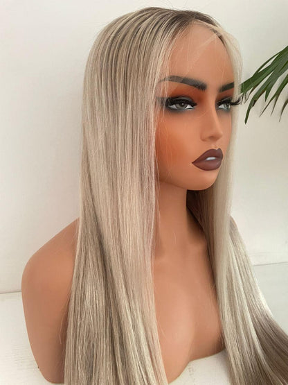 Blonde HD lace front wig with raw human hair and adjustable cap by Gaurash Beauty Supply displayed on a mannequin head.