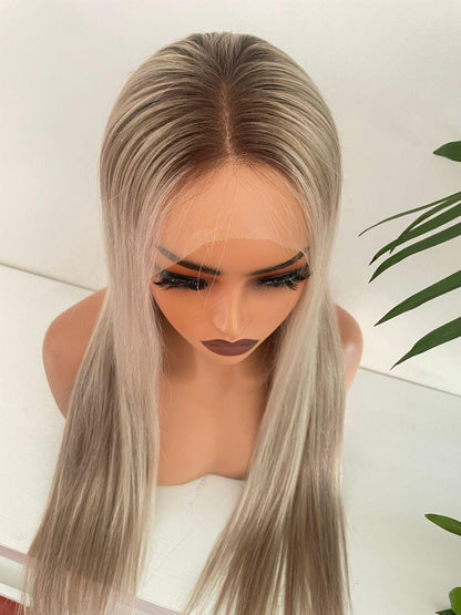 Blonde HD lace front wig made from raw human hair with adjustable cap, styled on a mannequin head for Gaurash Beauty Supply.